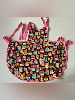 colorful, cupcake-patterned kitchen apron with pink ties
